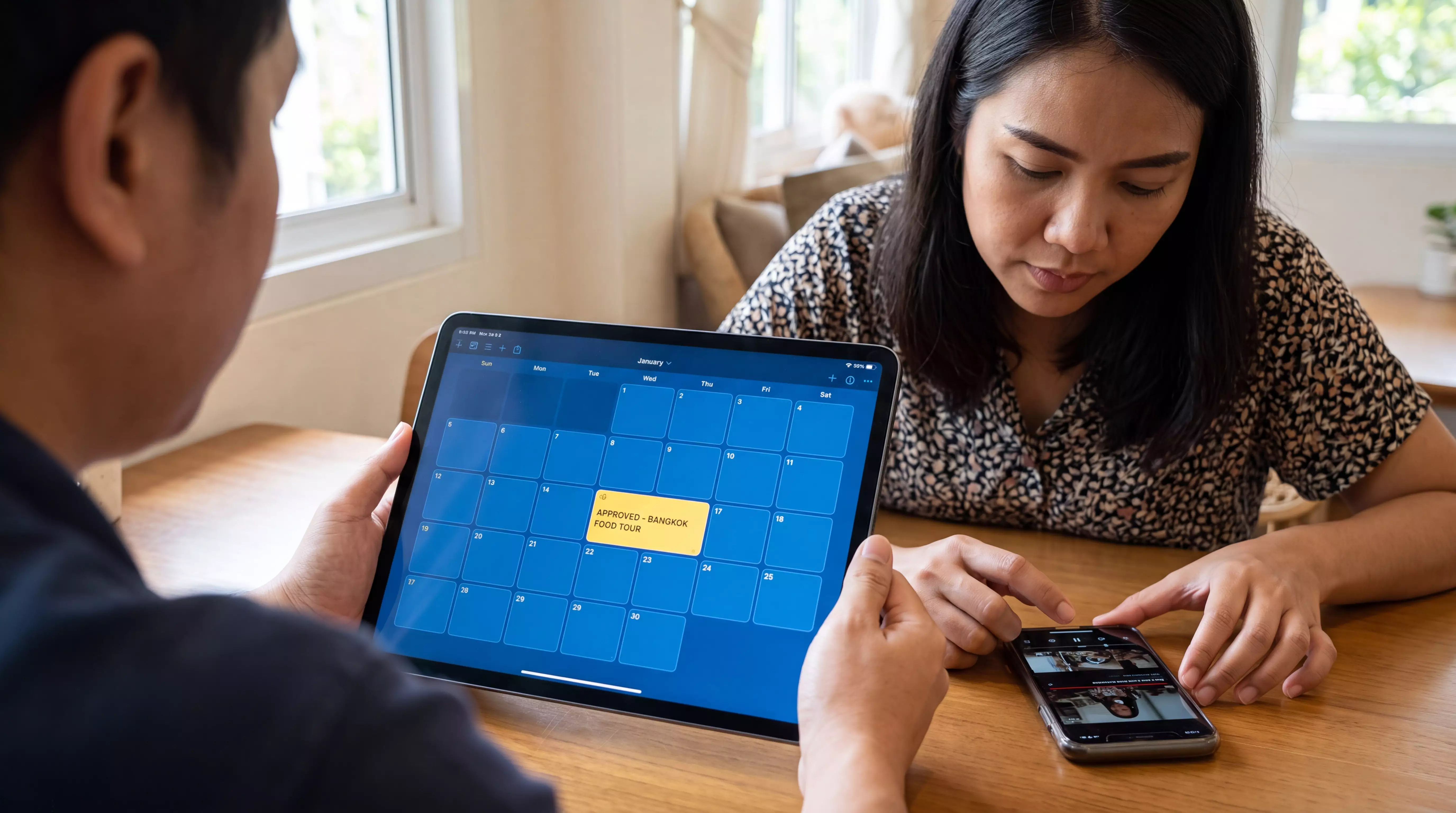 Creator reviewing phone and tablet analytics