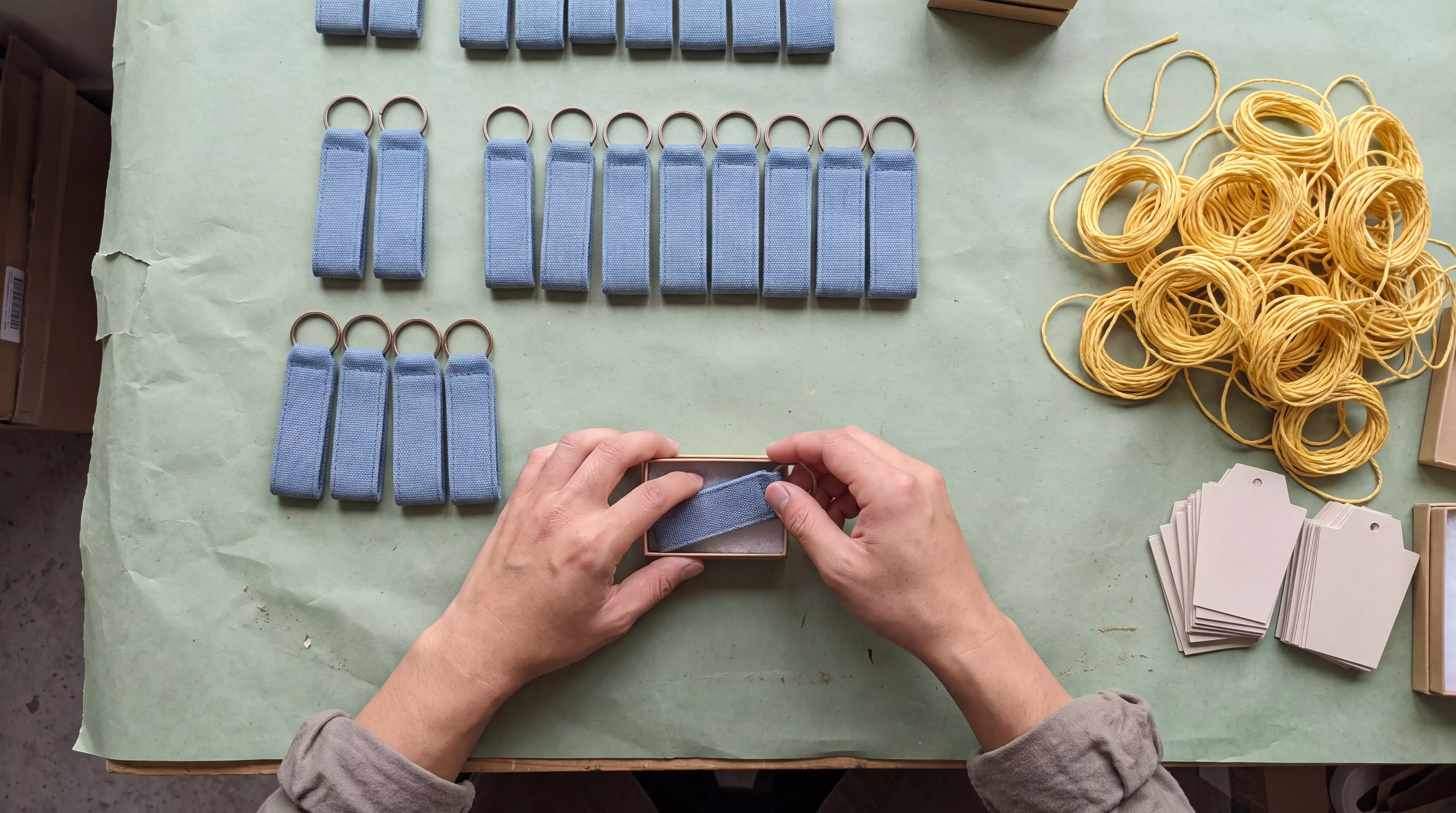 Thai hands packing keychains