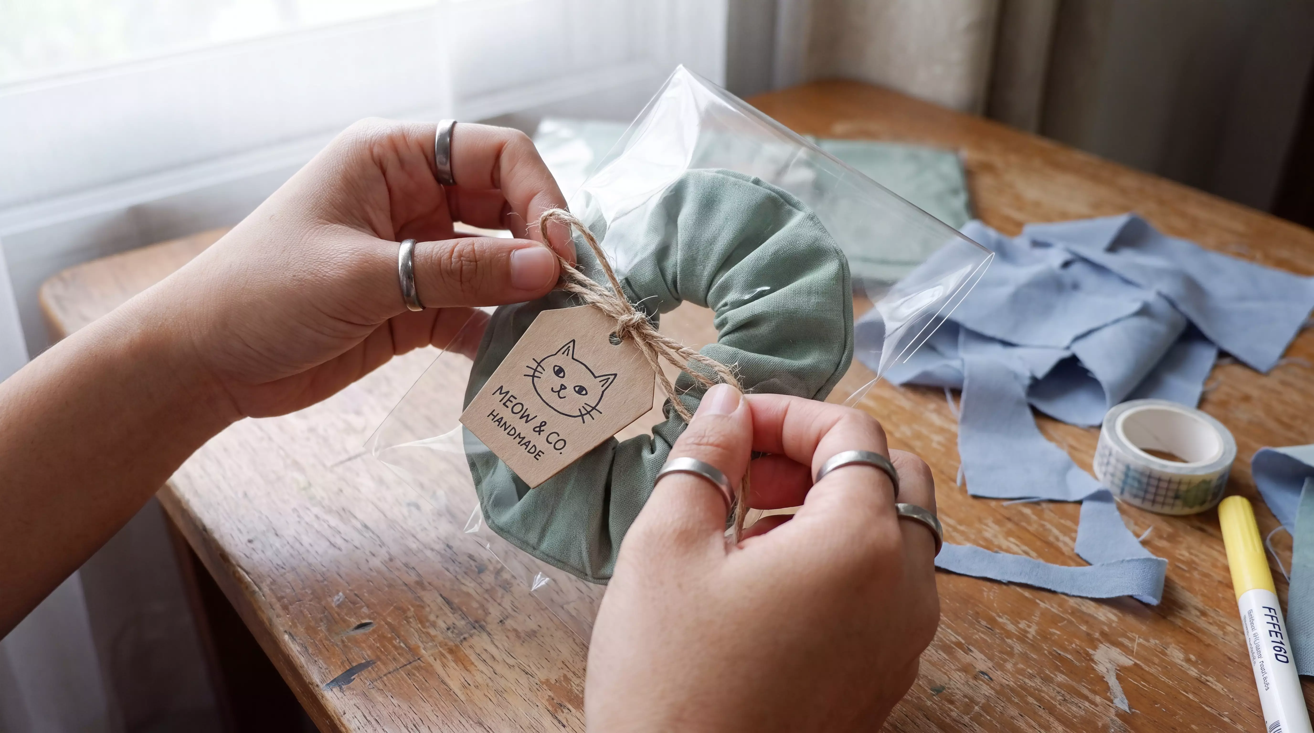 Tying a tag onto a scrunchie