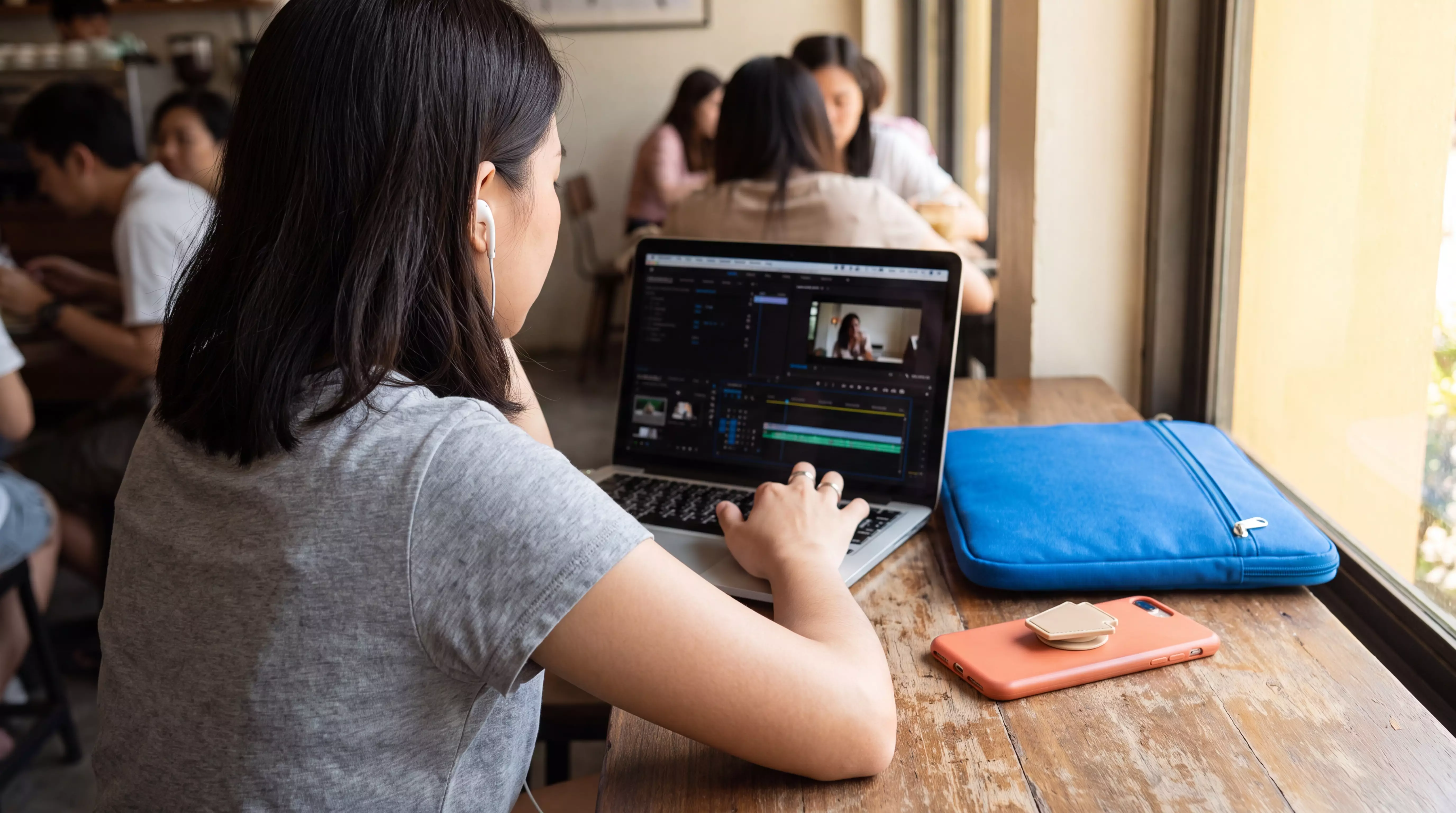 Thai creator scrubbing a video timeline